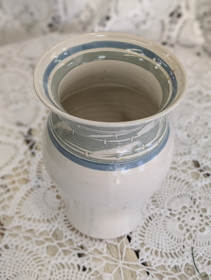 Handmade studio pottery vase with white glaze and blue/gray bands