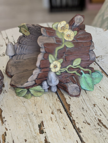 Ceramic bunny and log