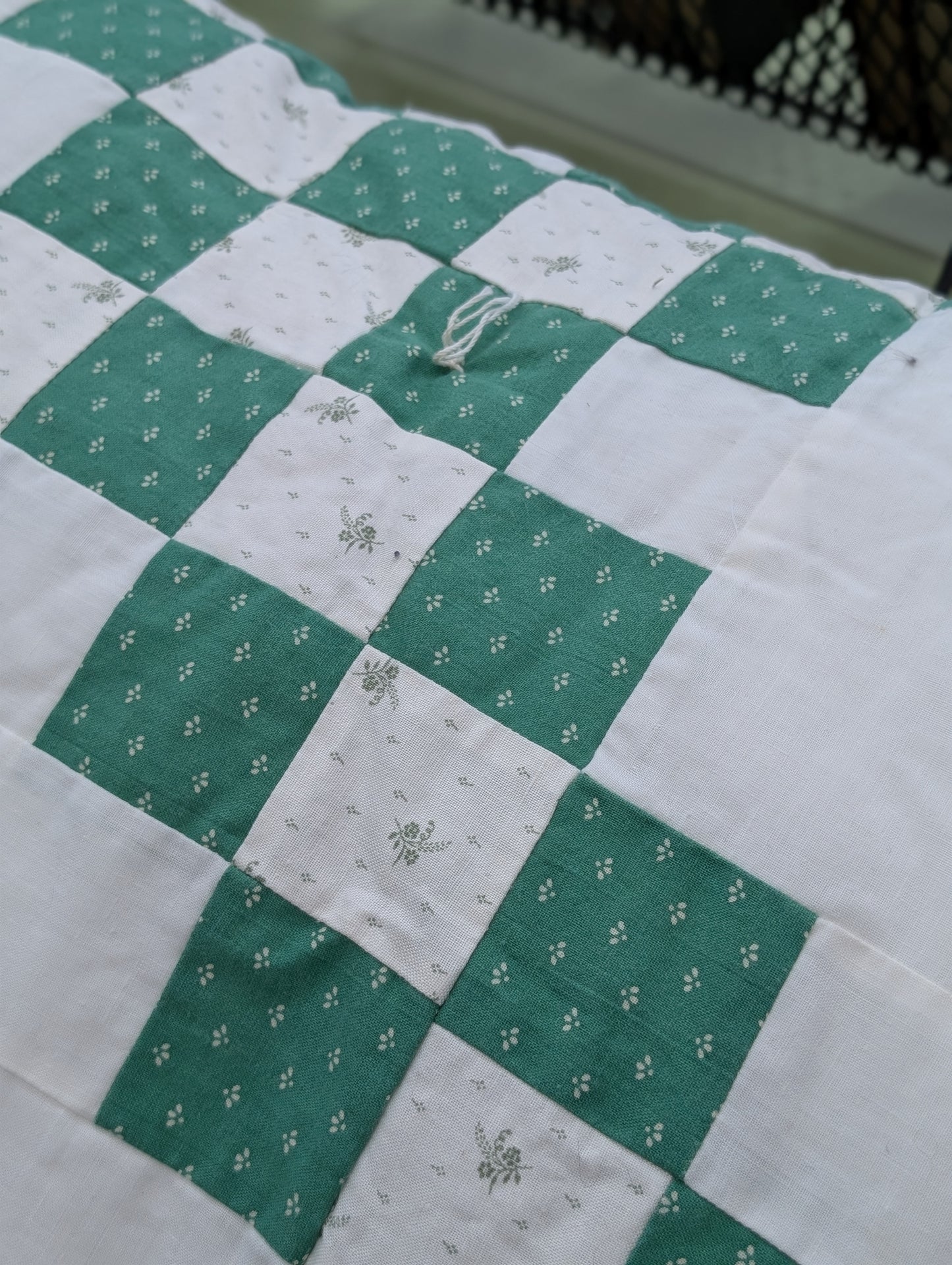 Green and white quilt