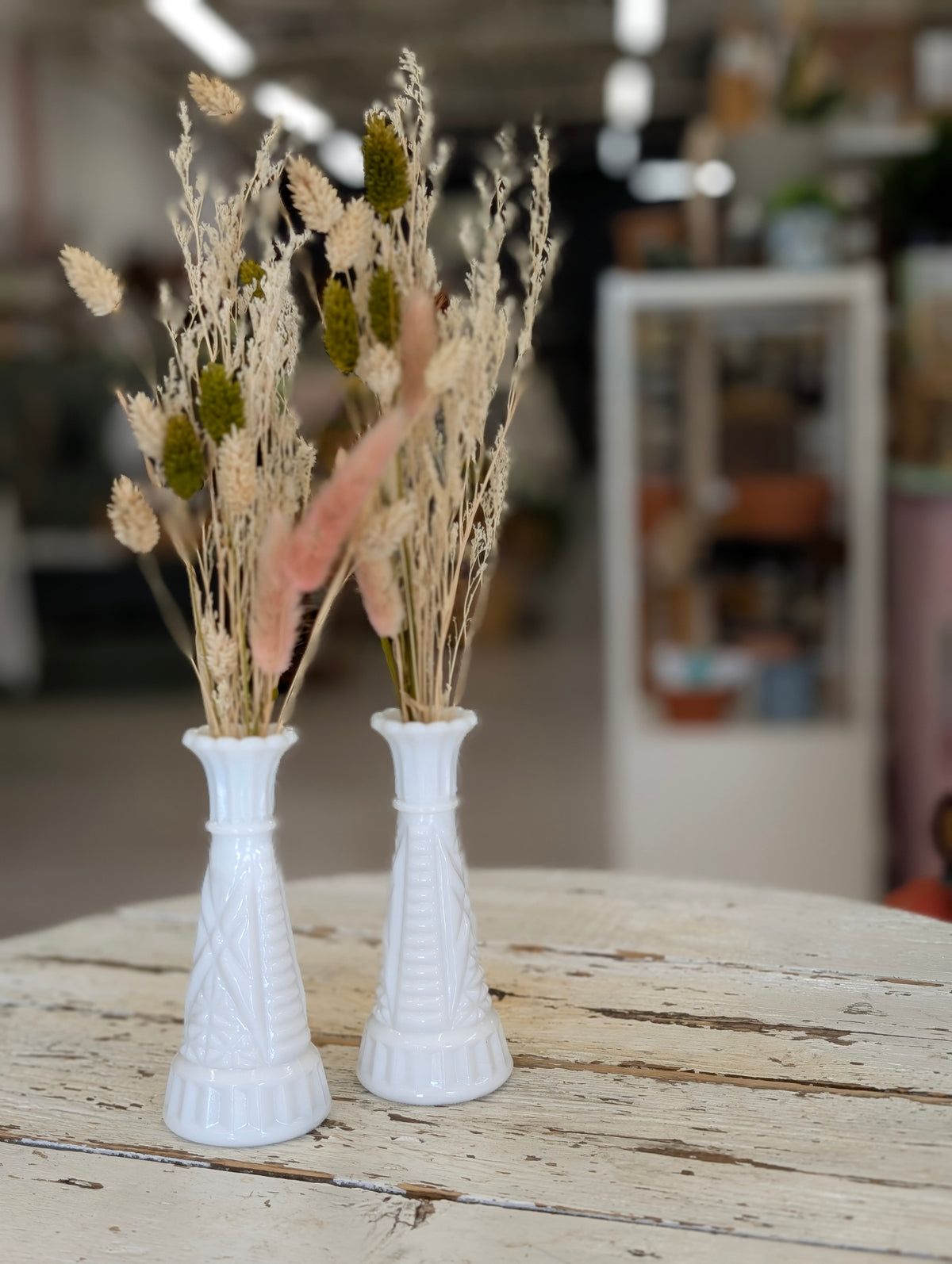 Milk glass vase with dried flowers