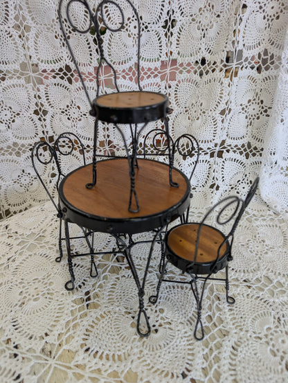 wrought iron and wood miniature bistro set with four chairs