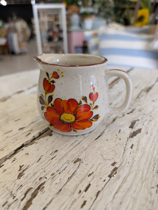 Creamer orange flower