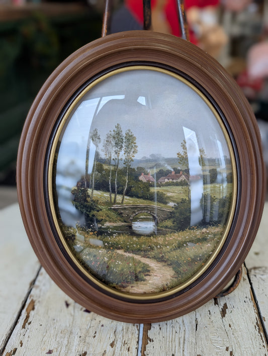 Oval frame scenery art
