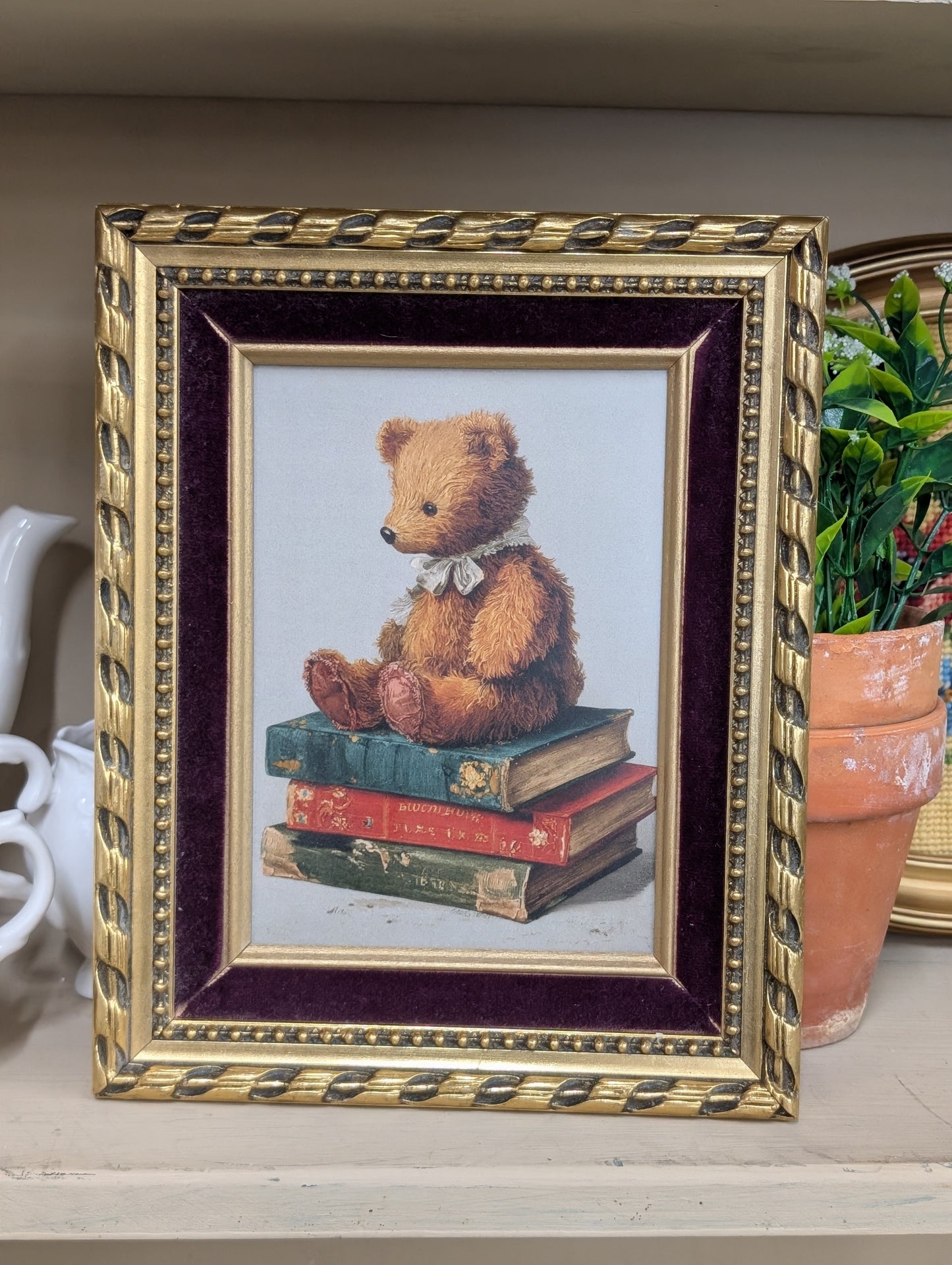 Framed bear with book stack