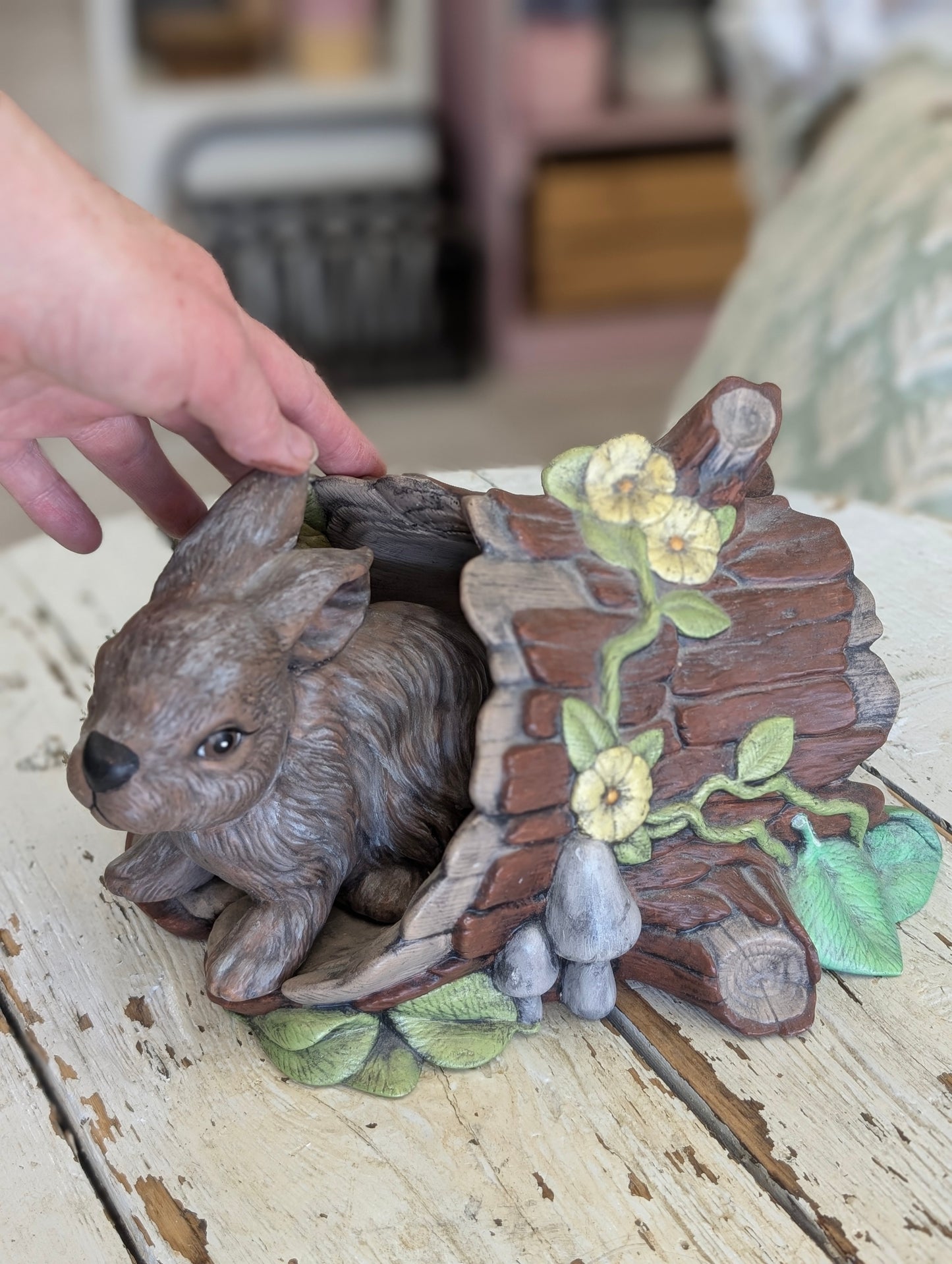 Ceramic bunny and log