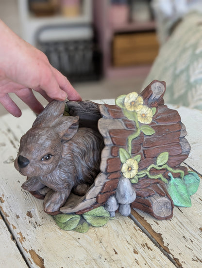 Ceramic bunny and log